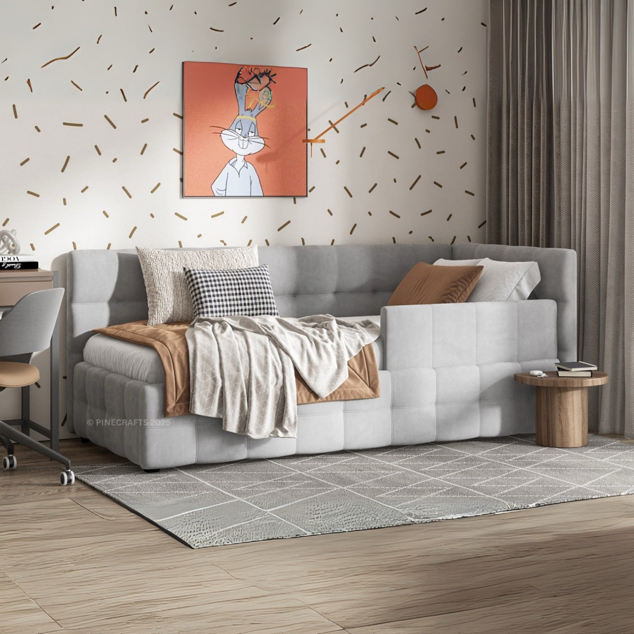 Gray sectional sofa in a living room with decorative pillows and a painting on the wall.