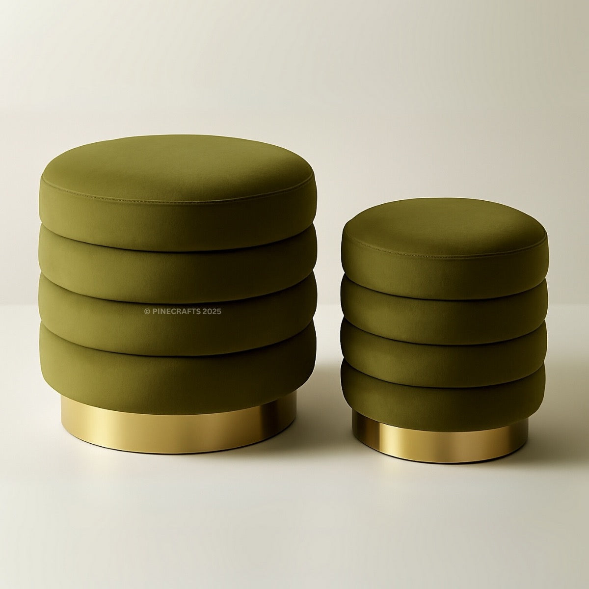 Two green ottomans with gold bases on a beige background