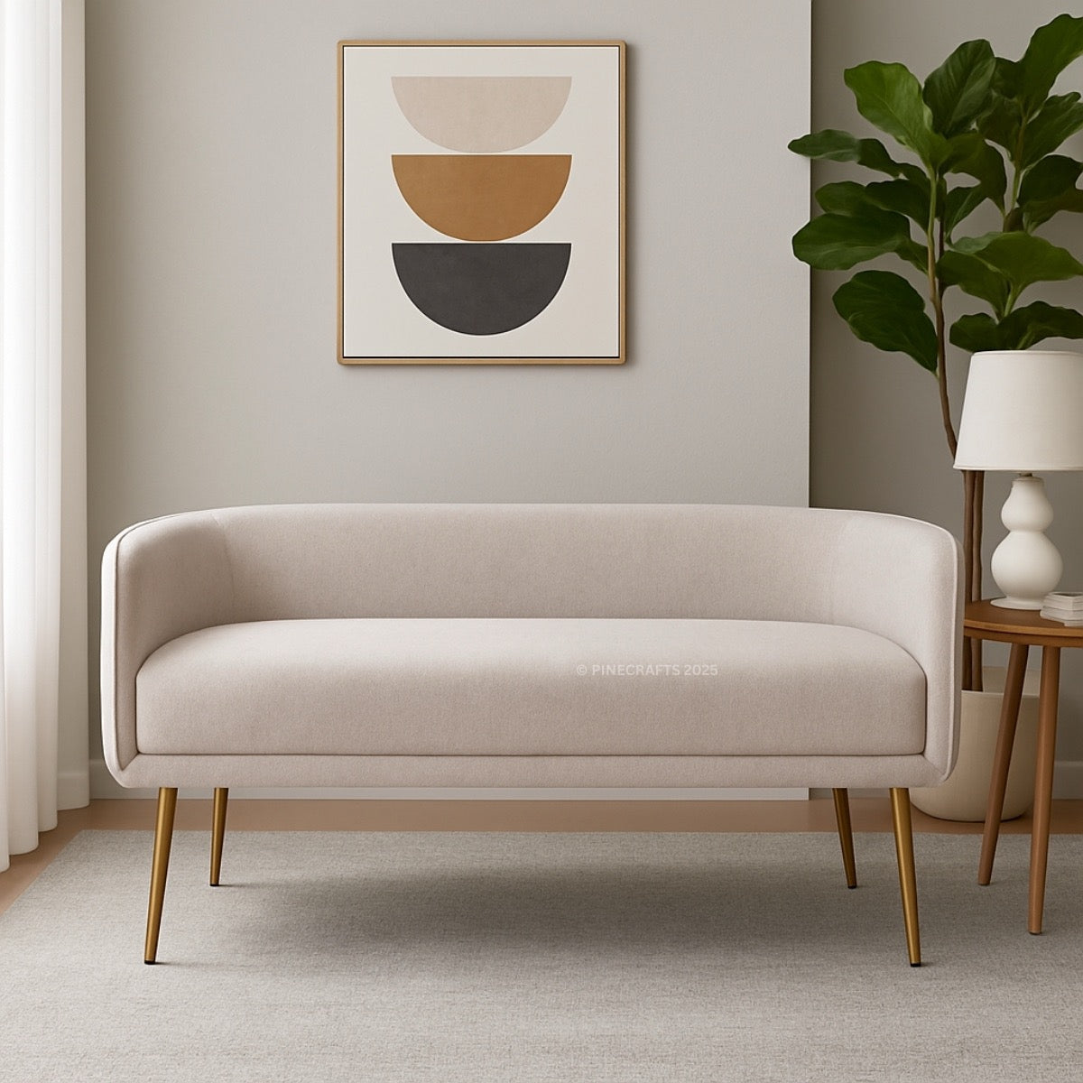 Beige sofa in a living room with abstract art and a plant
