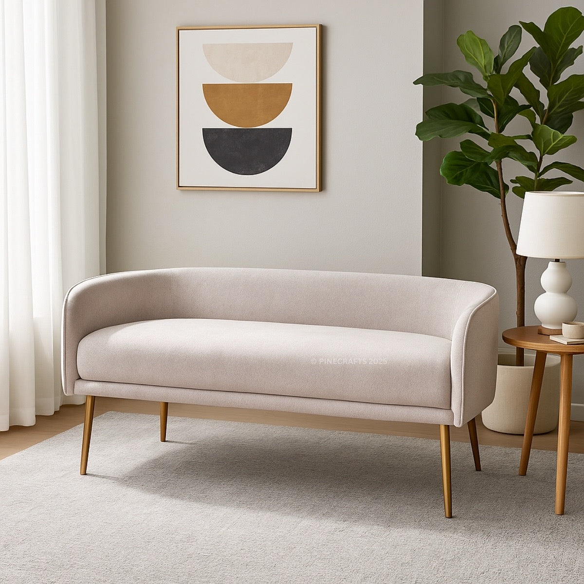 Beige sofa in a living room with a abstract art piece on the wall and a plant.