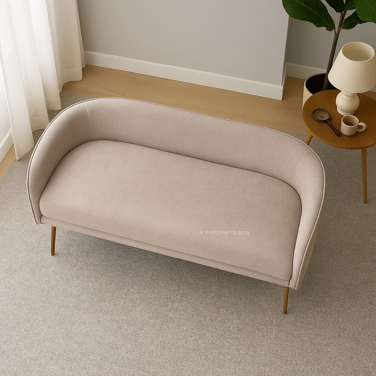 Beige sofa in a room with a small round table and lamp.