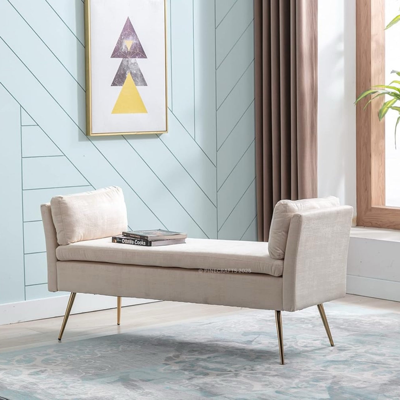 Beige bench in a room with a light blue wall, framed art, and a window.