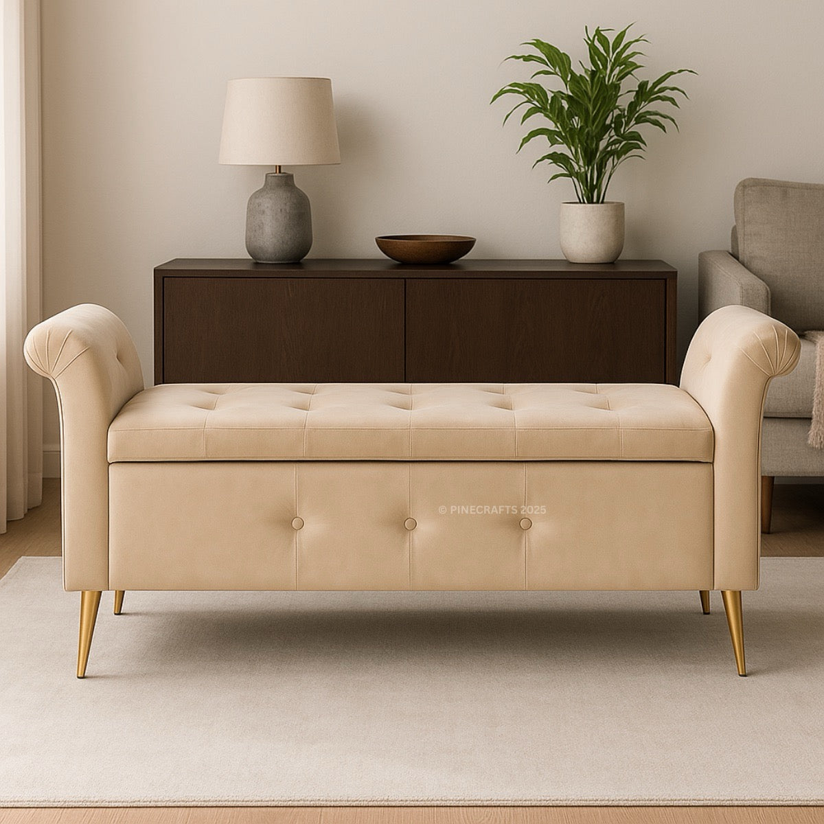 Beige tufted bench in a living room setting with a lamp and plant.
