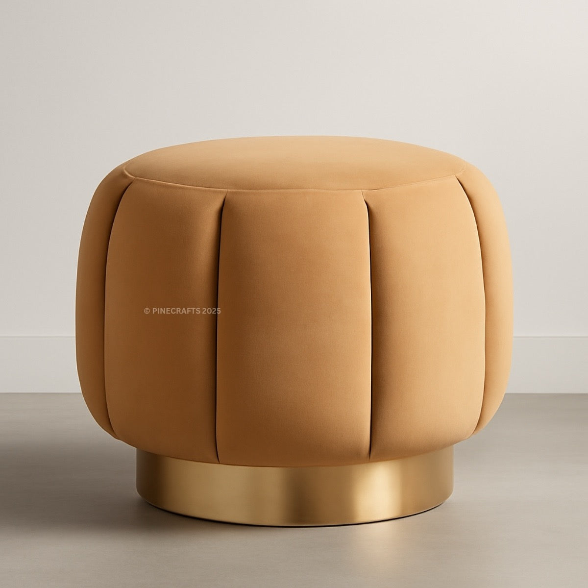 Brown cushioned stool with a gold base on a neutral background