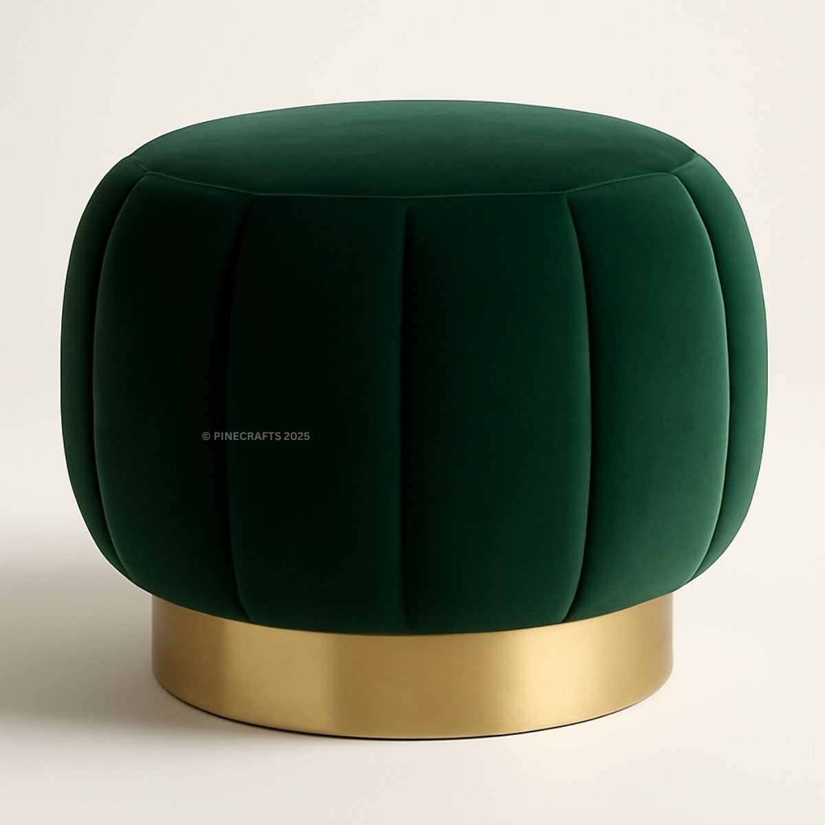 Green velvet ottoman with a gold base on a light background
