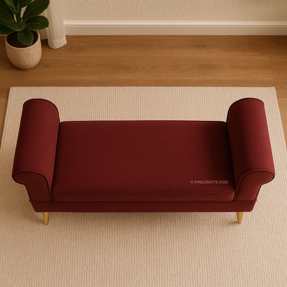 Red bench on a beige rug with a plant and white curtains in the background