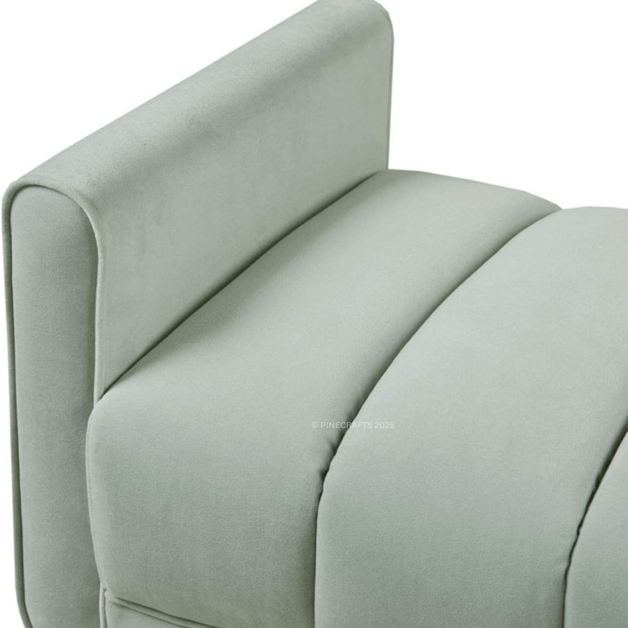 Close-up of a light gray upholstered chair armrest on a white background
