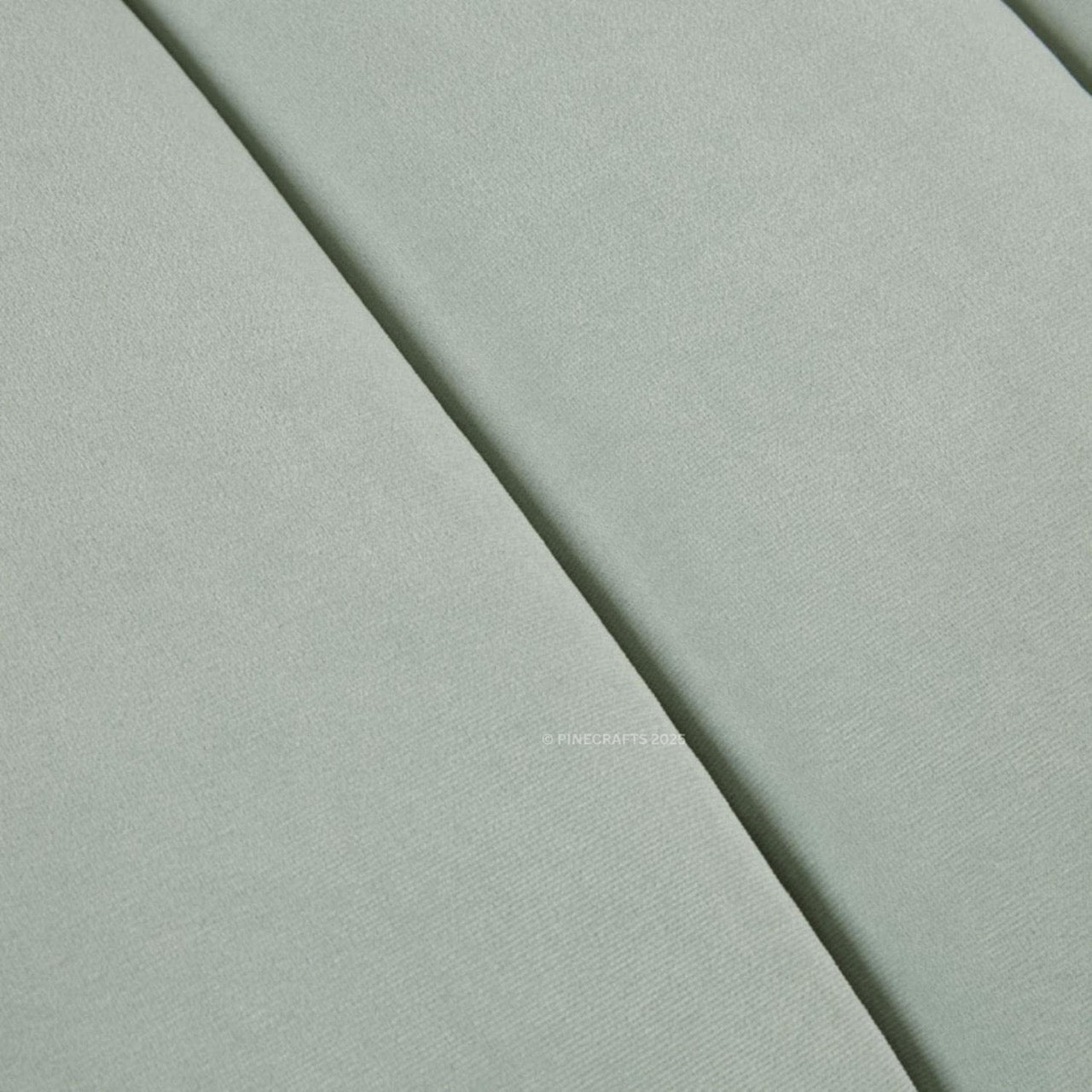 Close-up of light gray fabric with a subtle texture