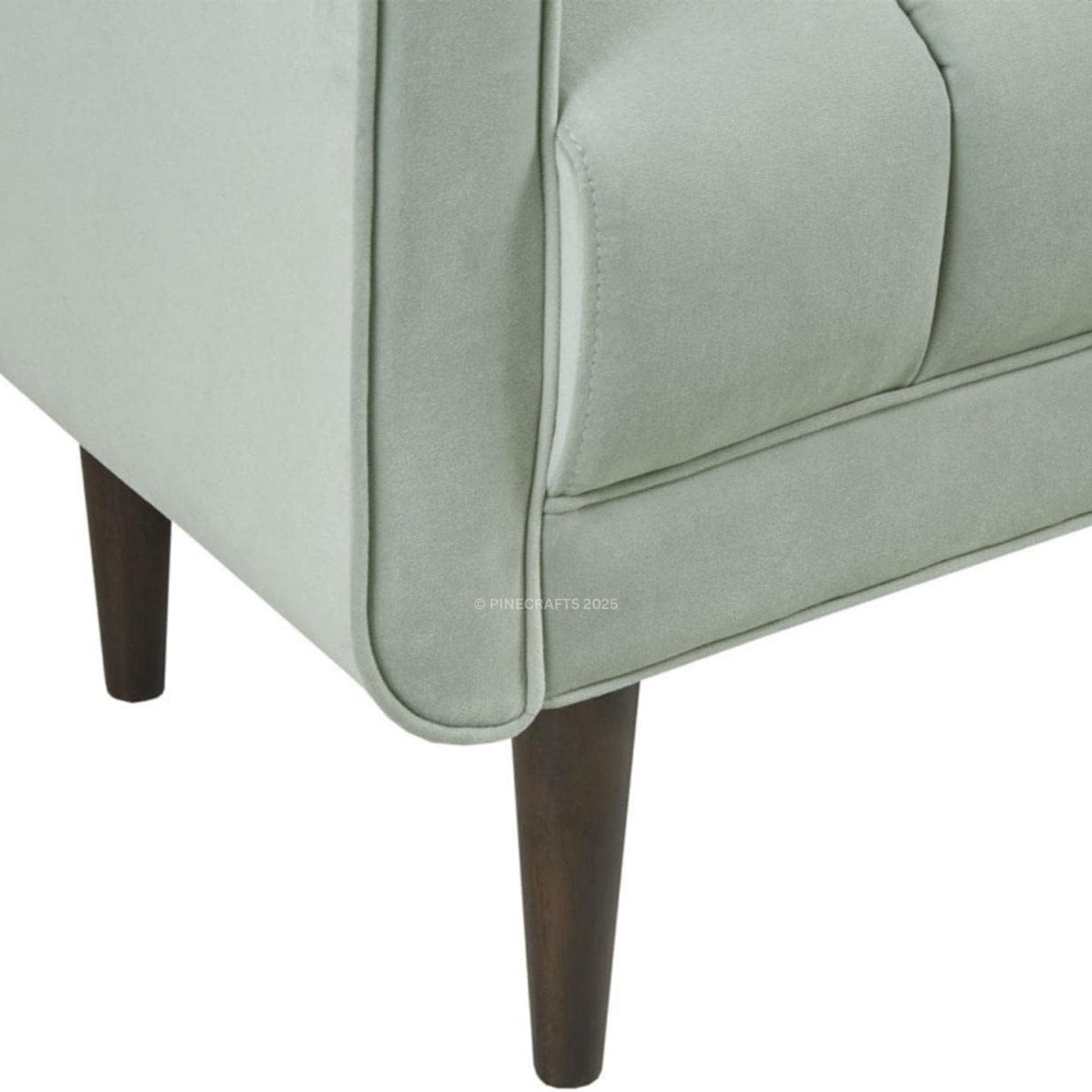 Light gray upholstered chair with dark wooden legs on a white background
