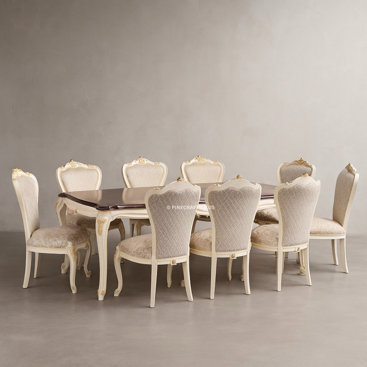 Dining table set with eight ornate chairs against a plain wall.
