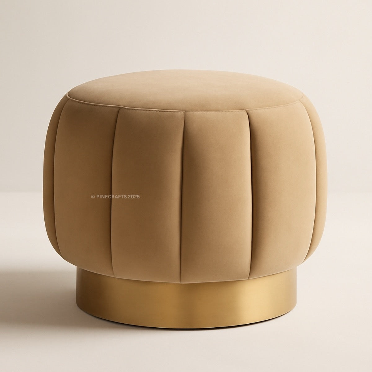 Beige ottoman with a gold base on a beige background