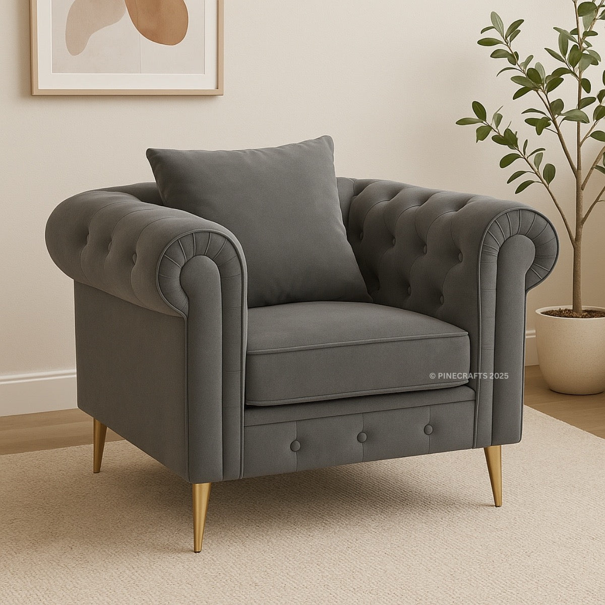 Gray armchair with tufted backrest and gold legs in a room setting.