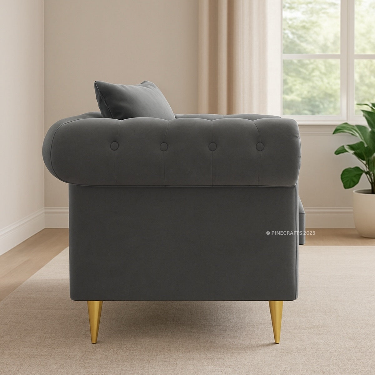 Gray armchair with gold legs in a room with a window and plant