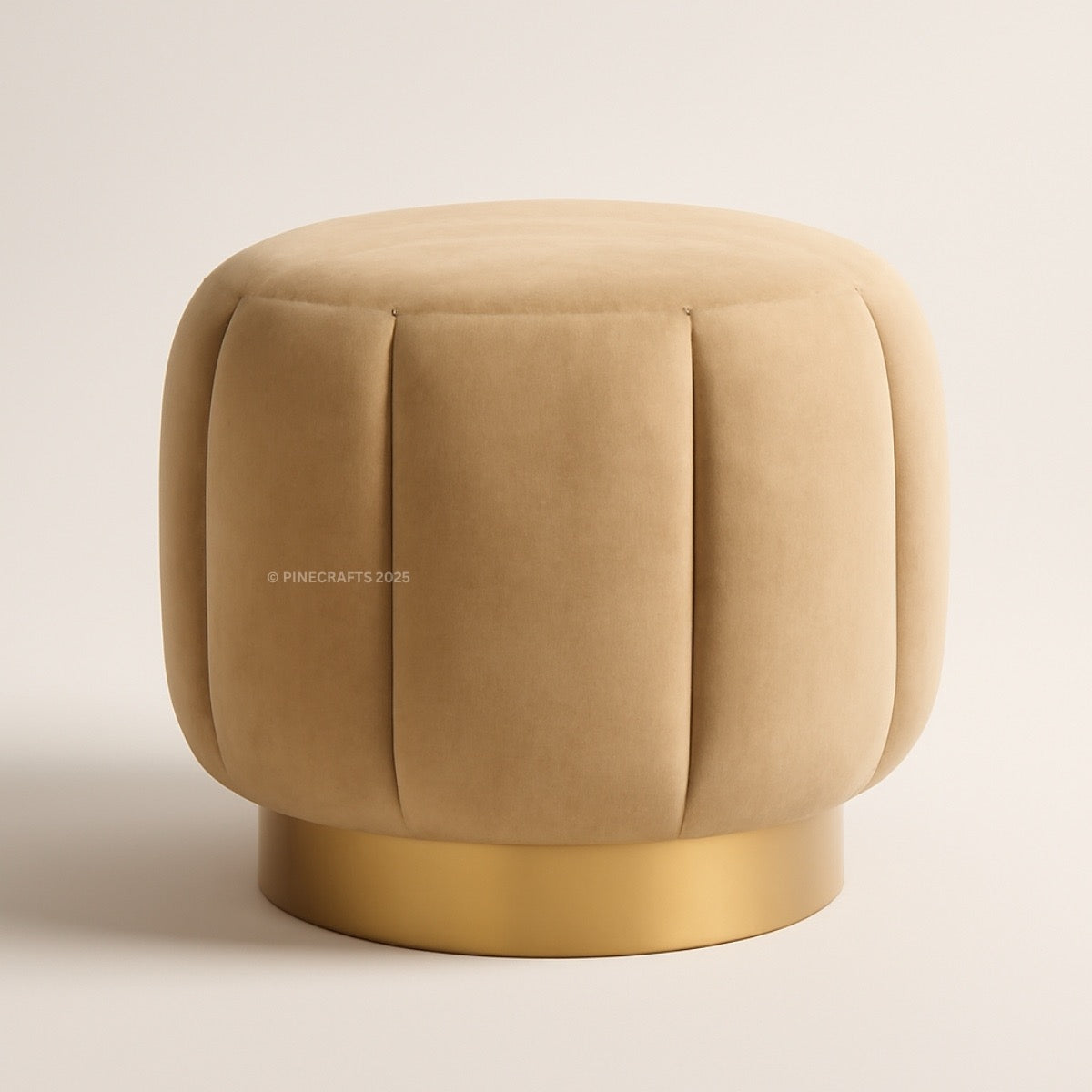 Beige ottoman with gold base on a beige background