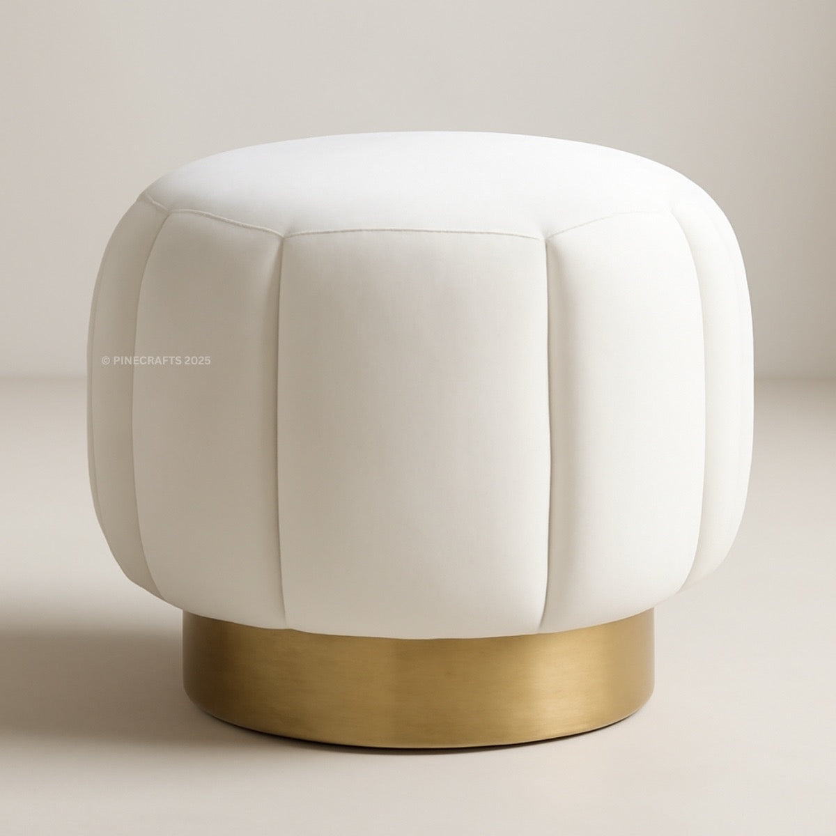White cushioned stool with a gold base on a neutral background