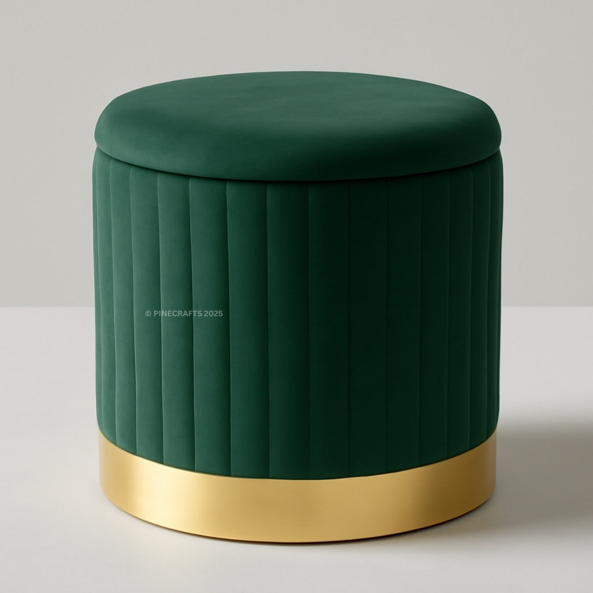 Green velvet ottoman with a gold base on a light gray background