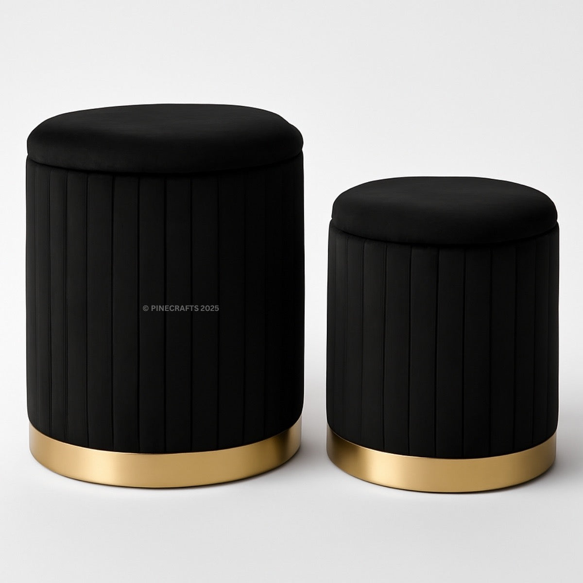 Two black stools with gold bases on a white background