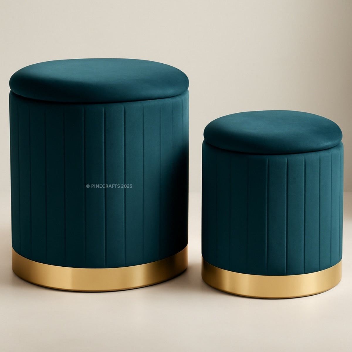Two teal ottomans with gold bases on a beige background