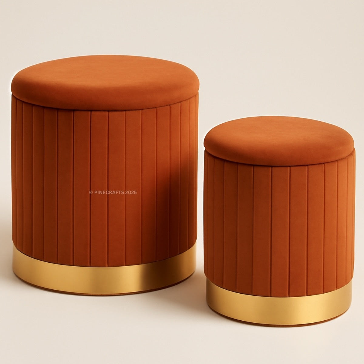 Two orange stools with gold bases on a beige background