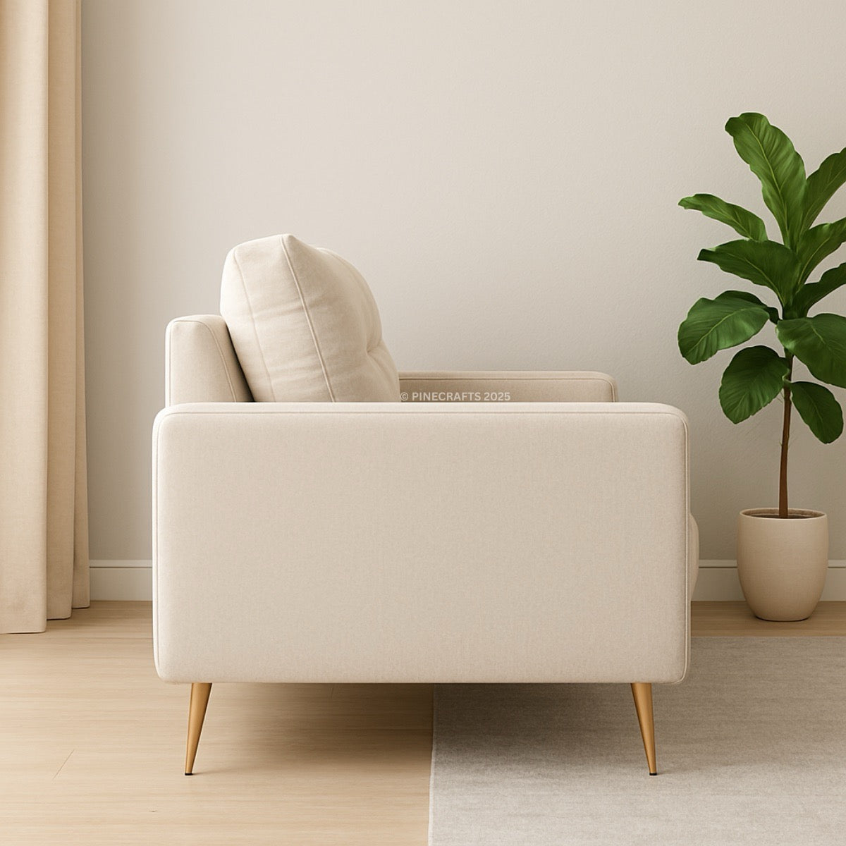Beige armchair in a room with a plant and neutral decor