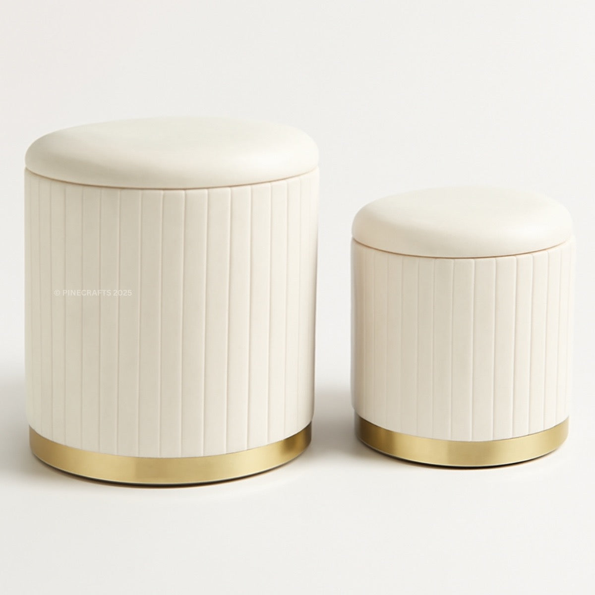 Two cylindrical ottomans with gold bases on a white background