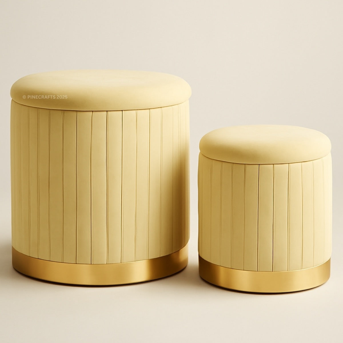 Two cylindrical storage jars with gold accents on a beige background