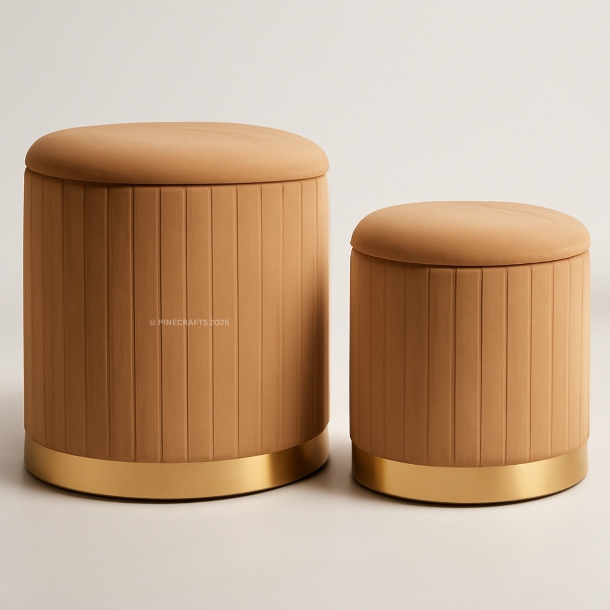 Two brown ottomans with gold bases on a beige background