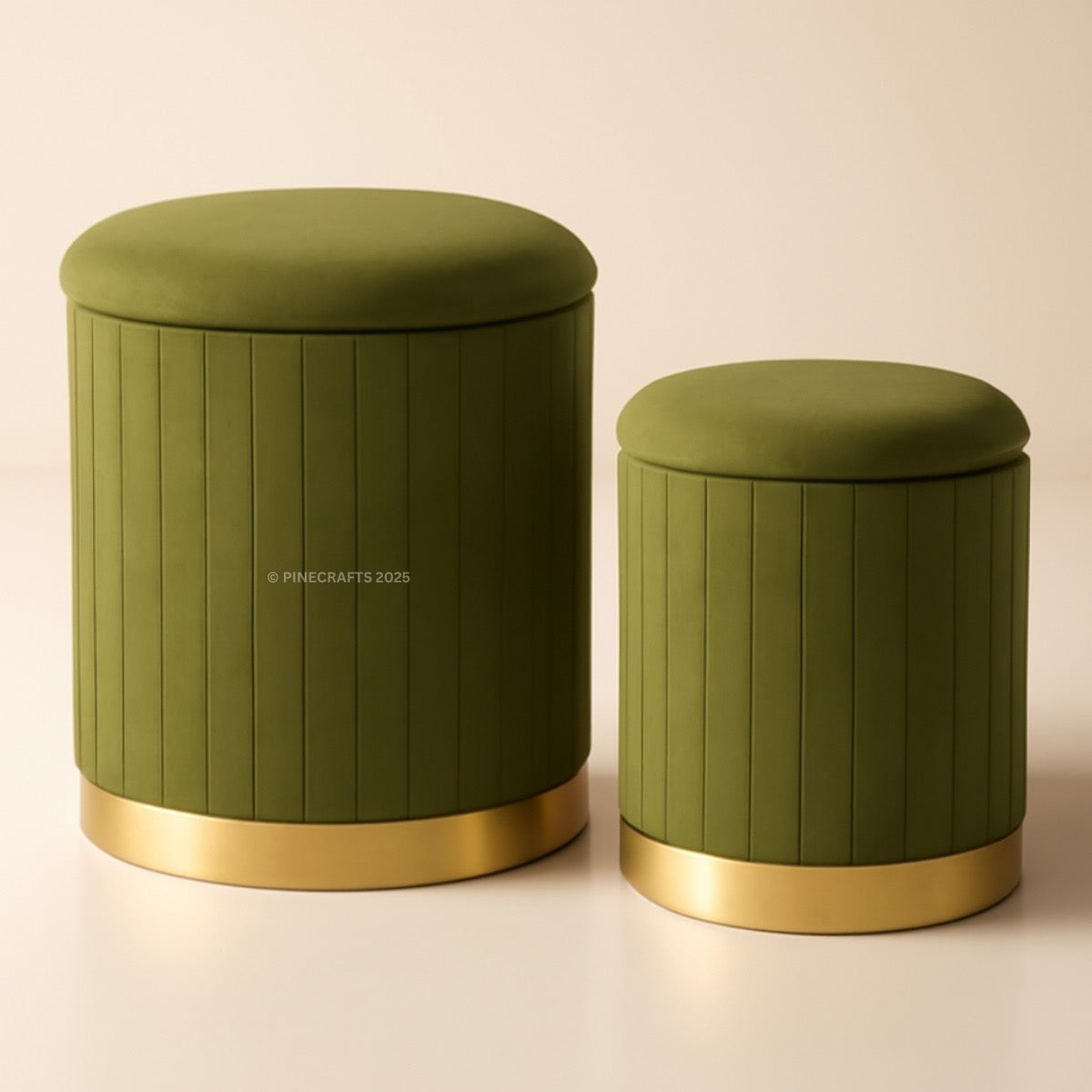 Two green ottomans with gold bases on a beige background