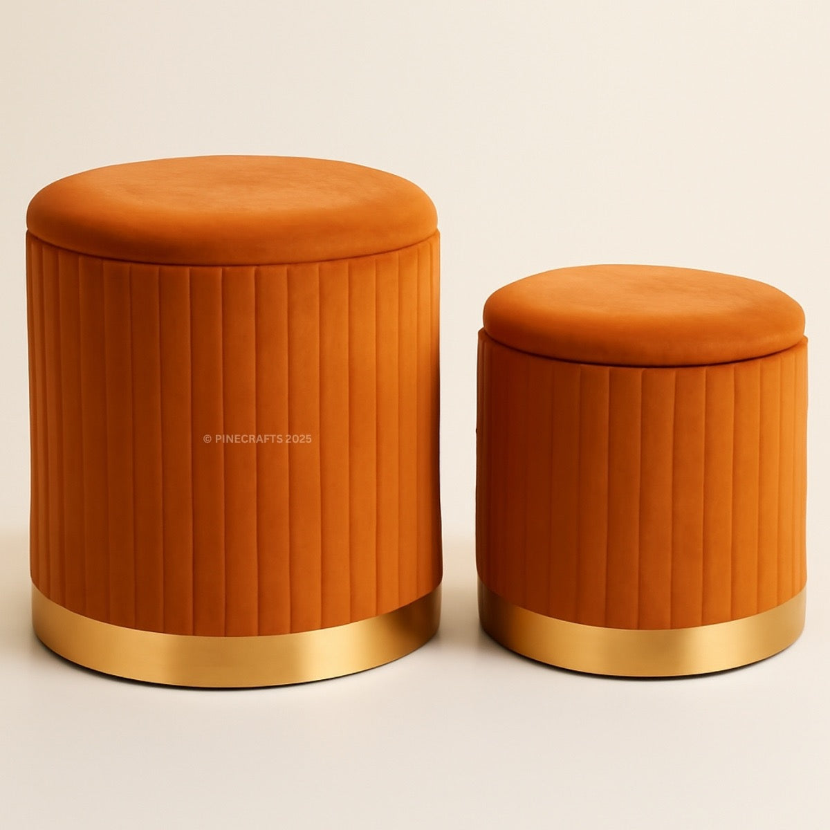 Two orange stools with gold bases on a beige background