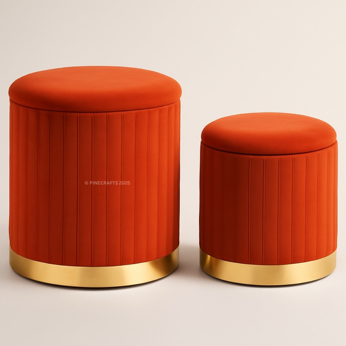 Two orange stools with gold bases on a beige background