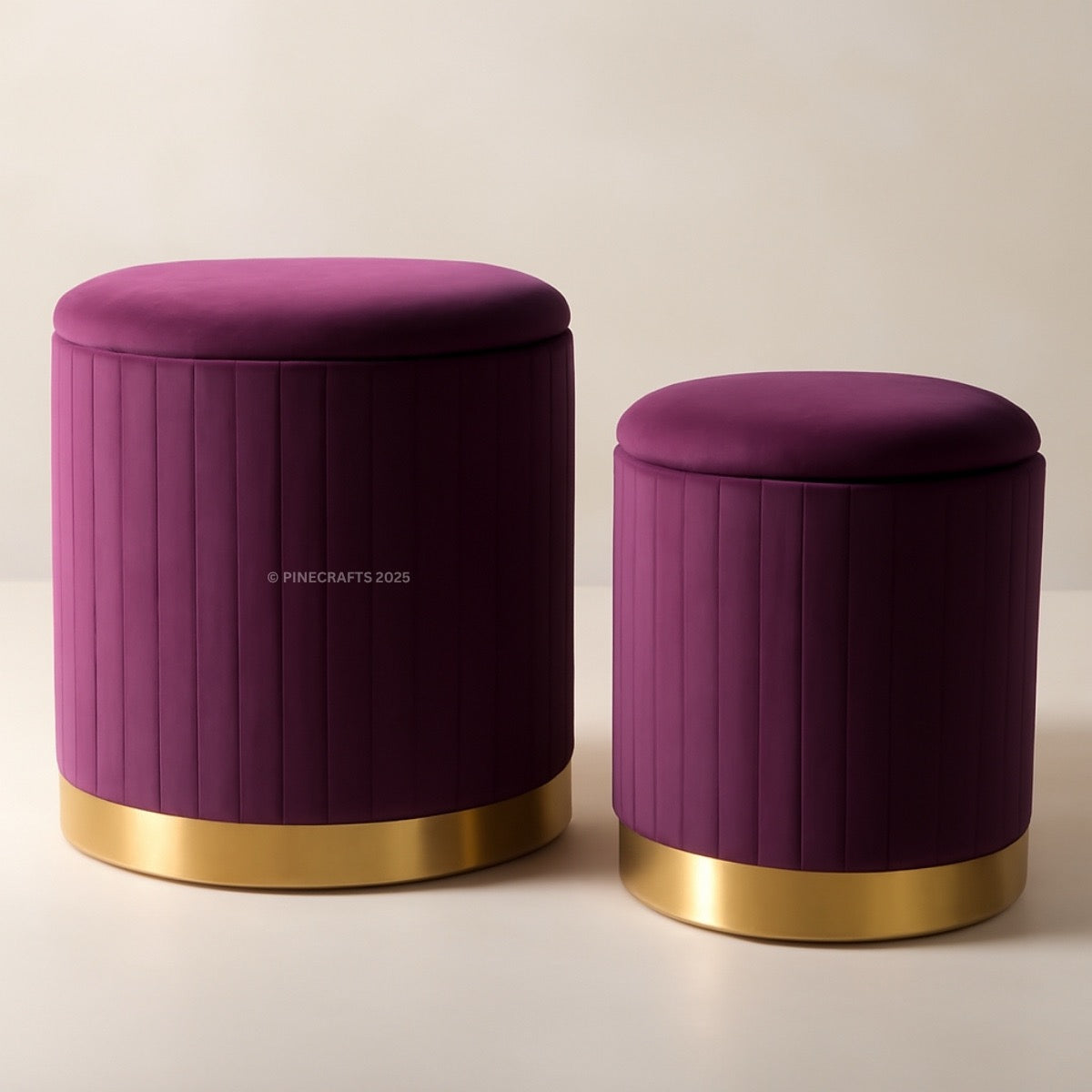 Two purple stools with gold bases on a beige background