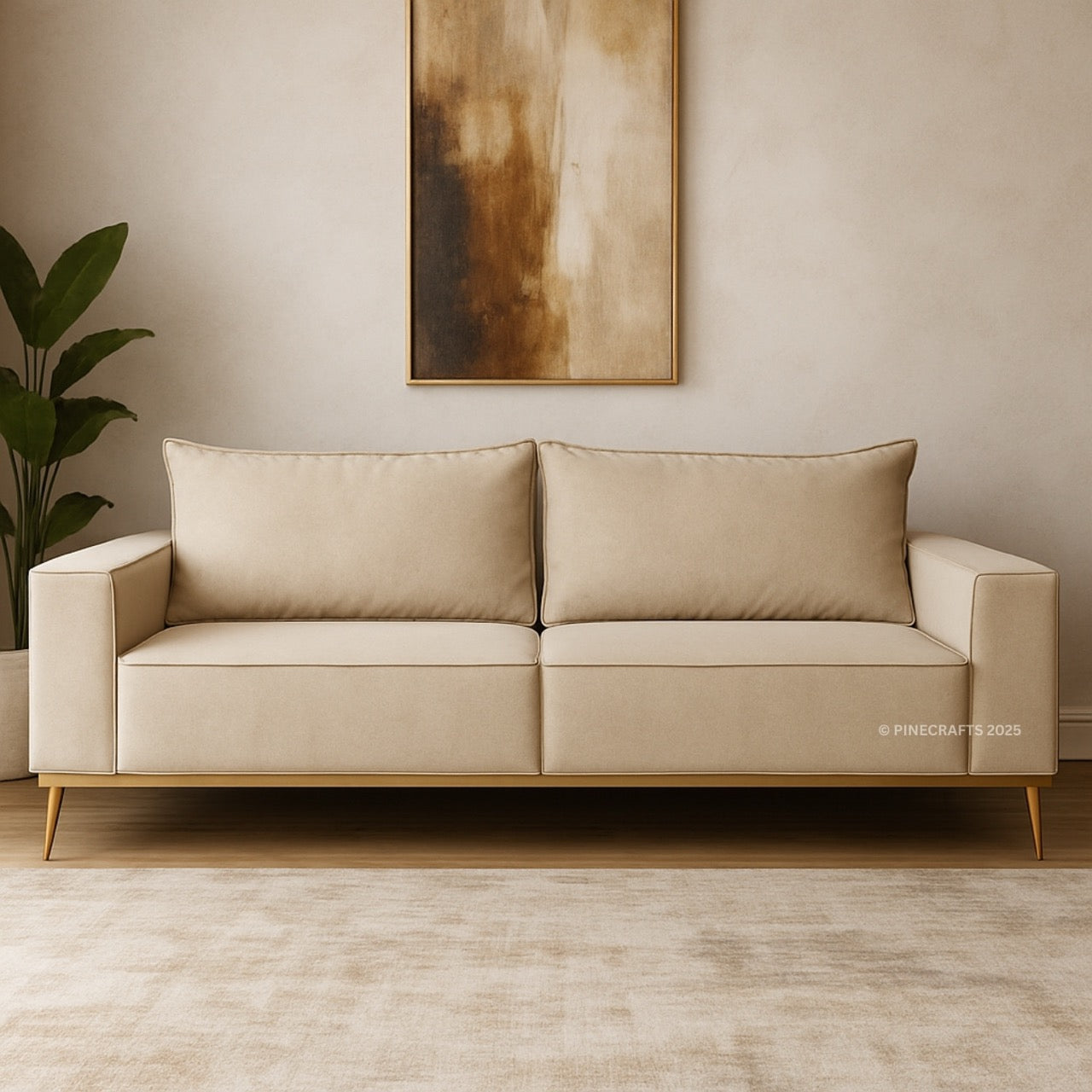 Beige sofa in a room with a plant and abstract art on the wall.