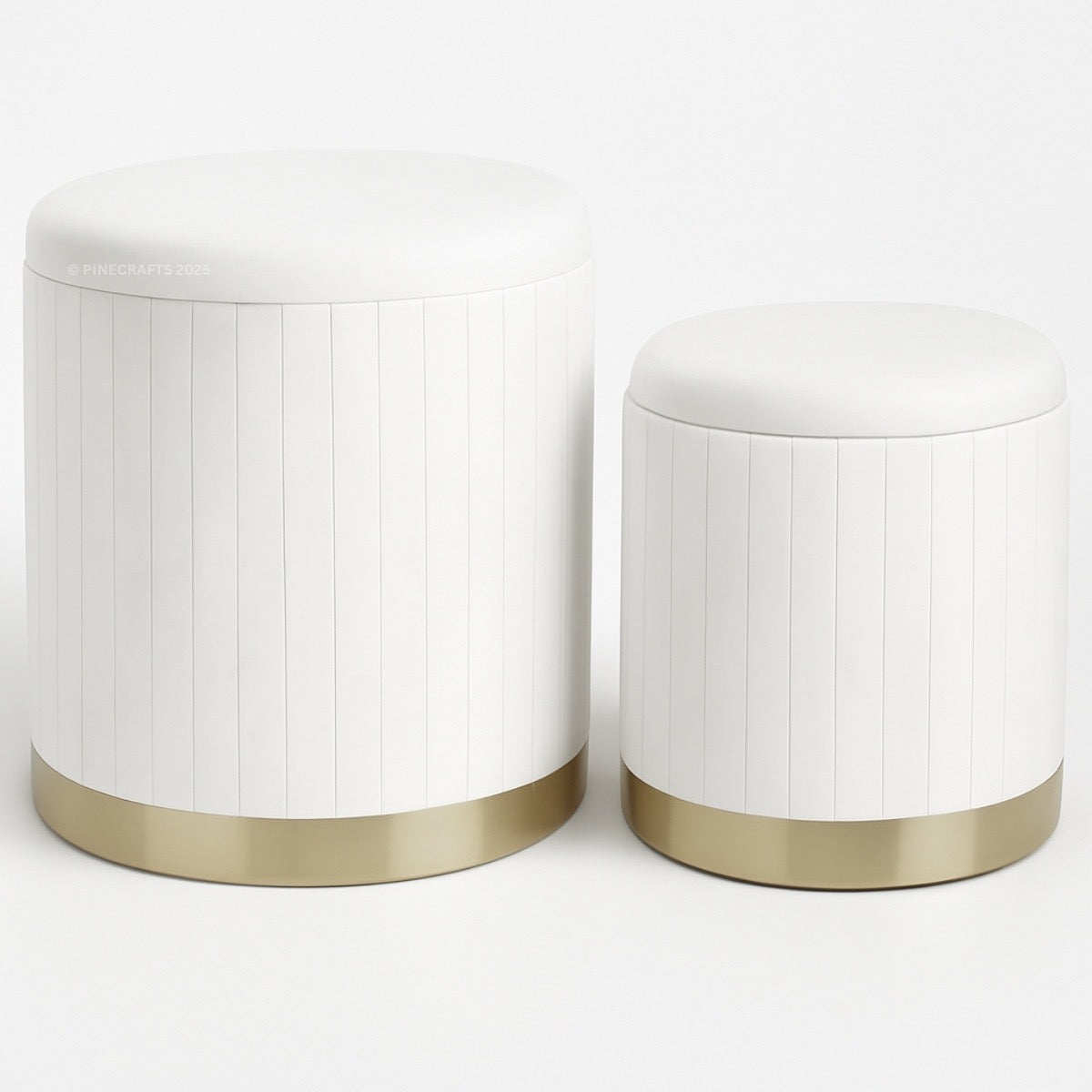 Two white cylindrical stools with gold bases on a white background