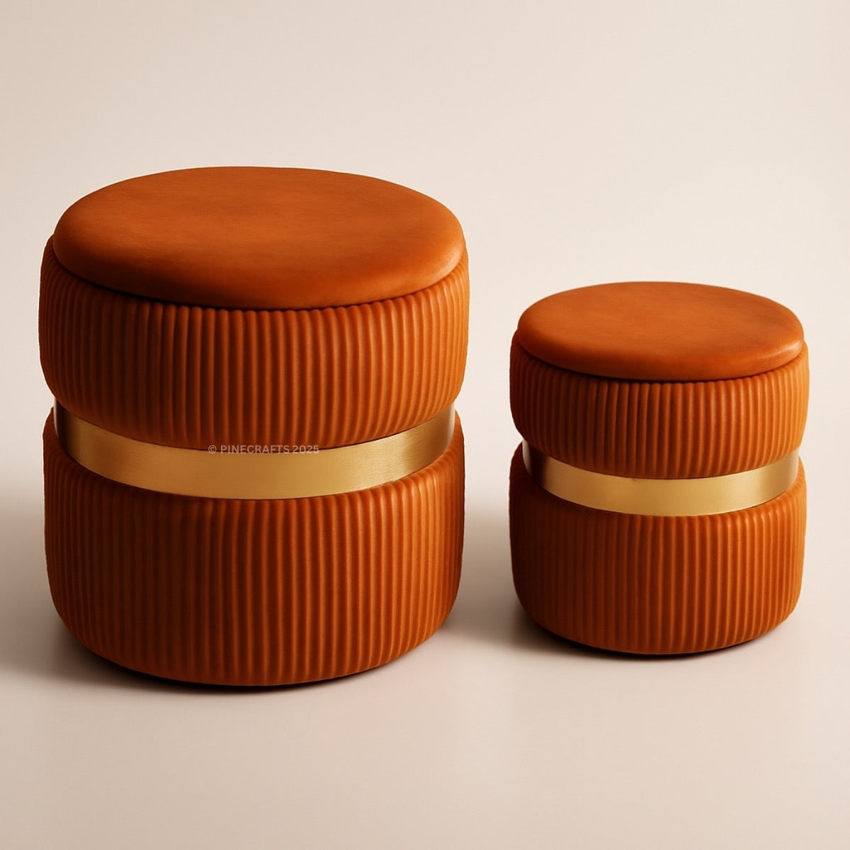 Two orange cylindrical containers with ribbed texture and gold bands on a beige background
