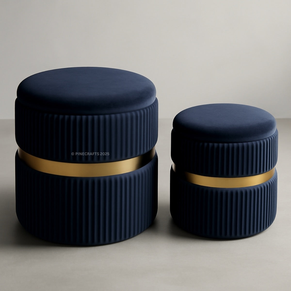 Two navy blue cylindrical containers with gold bands on a neutral background