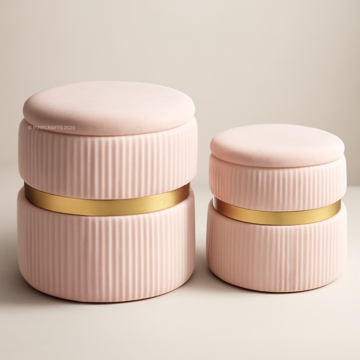 Two pink ceramic containers with gold bands on a light background