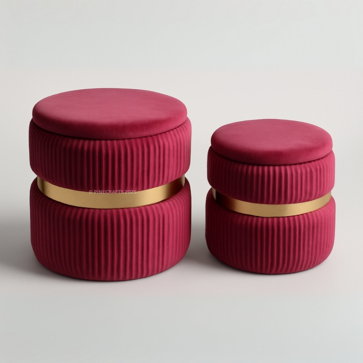 Two red cylindrical containers with gold bands on a light gray background