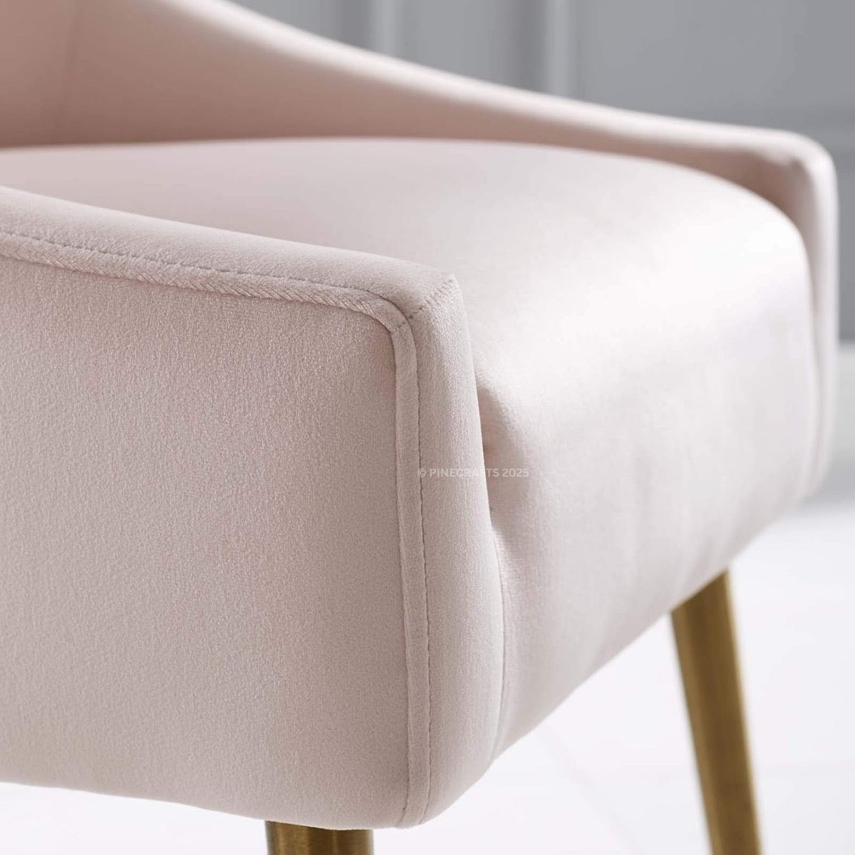 Close-up of a beige chair with a blurred background