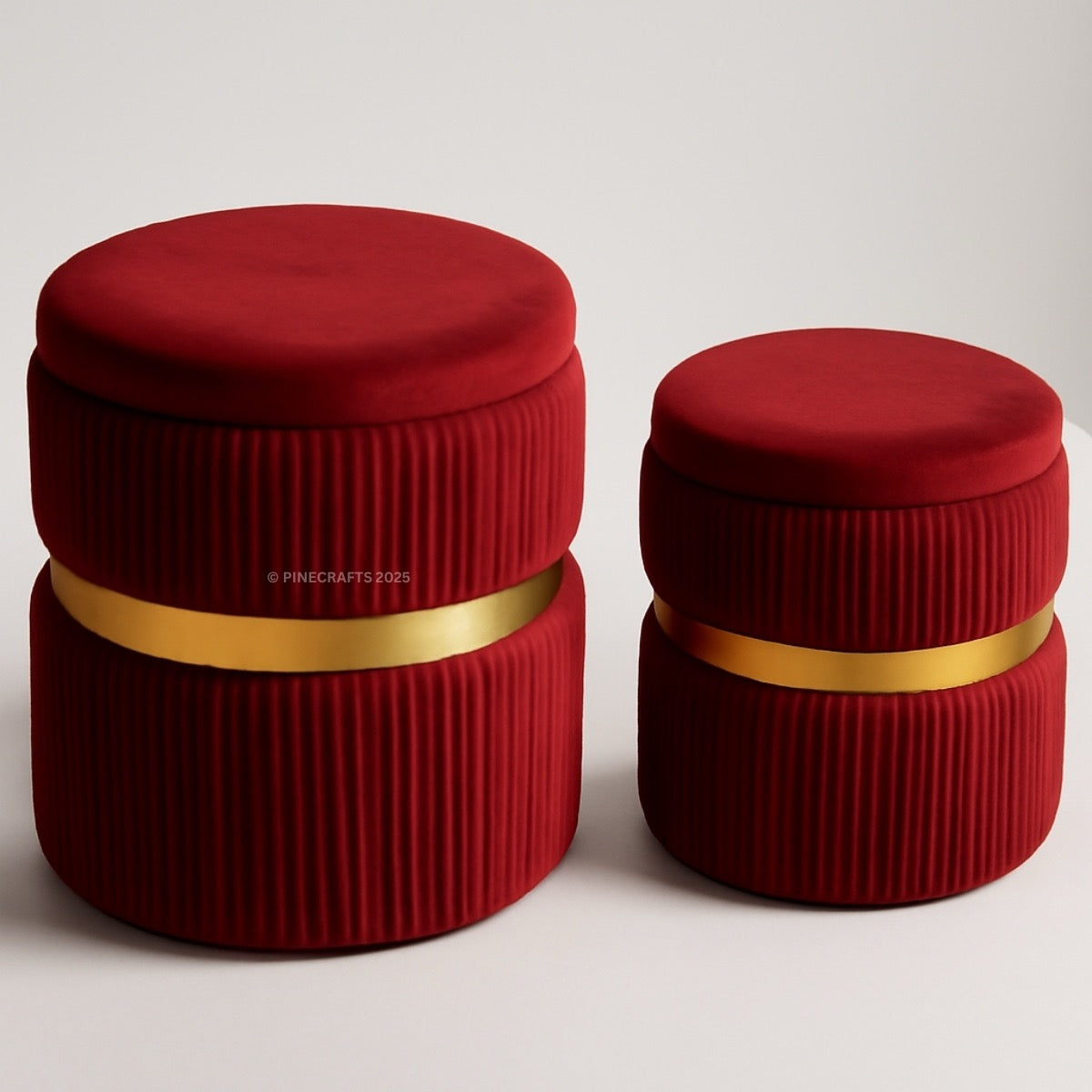 Two red cylindrical containers with gold bands on a light gray background
