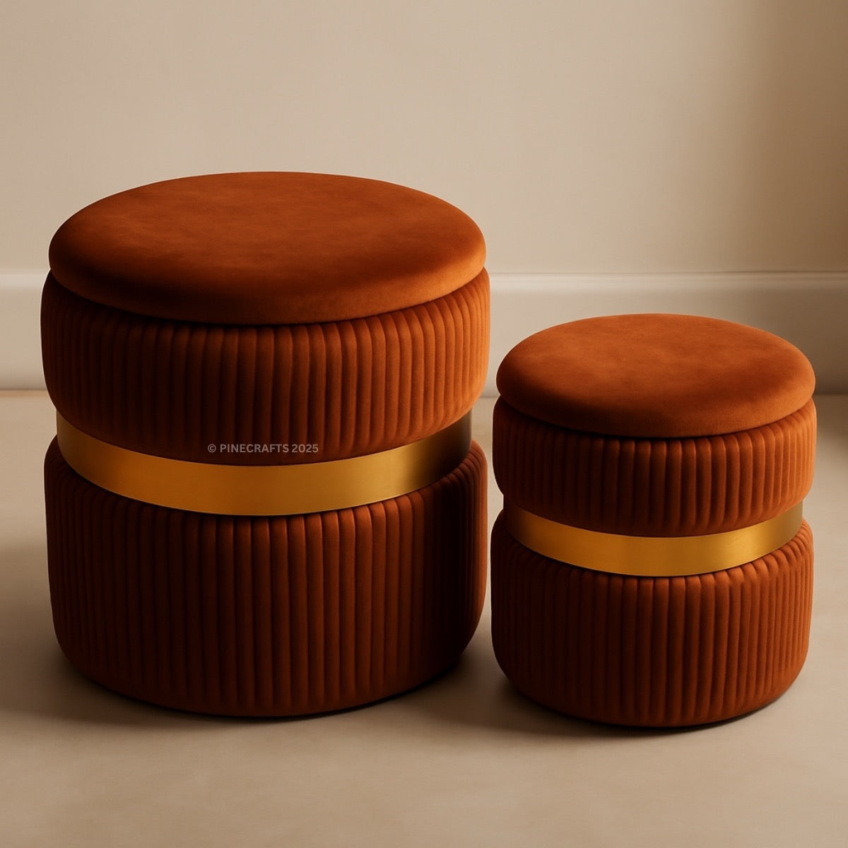 Two brown ottomans with gold bands on a beige background