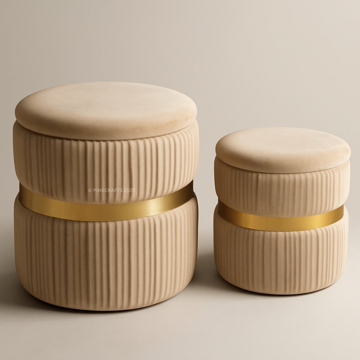 Two beige ottomans with gold bands on a beige background