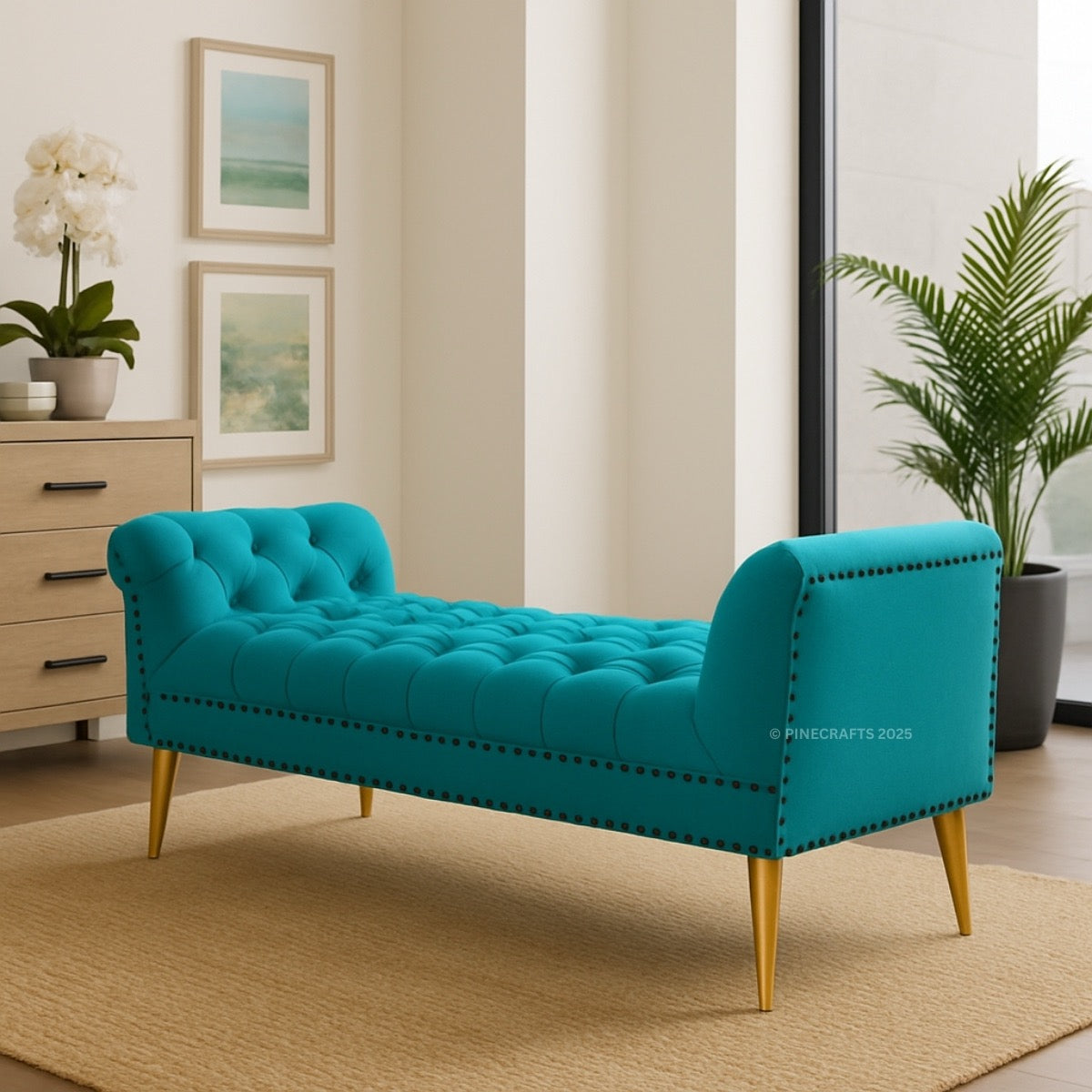Turquoise bench with gold legs in a room with plants and framed pictures.