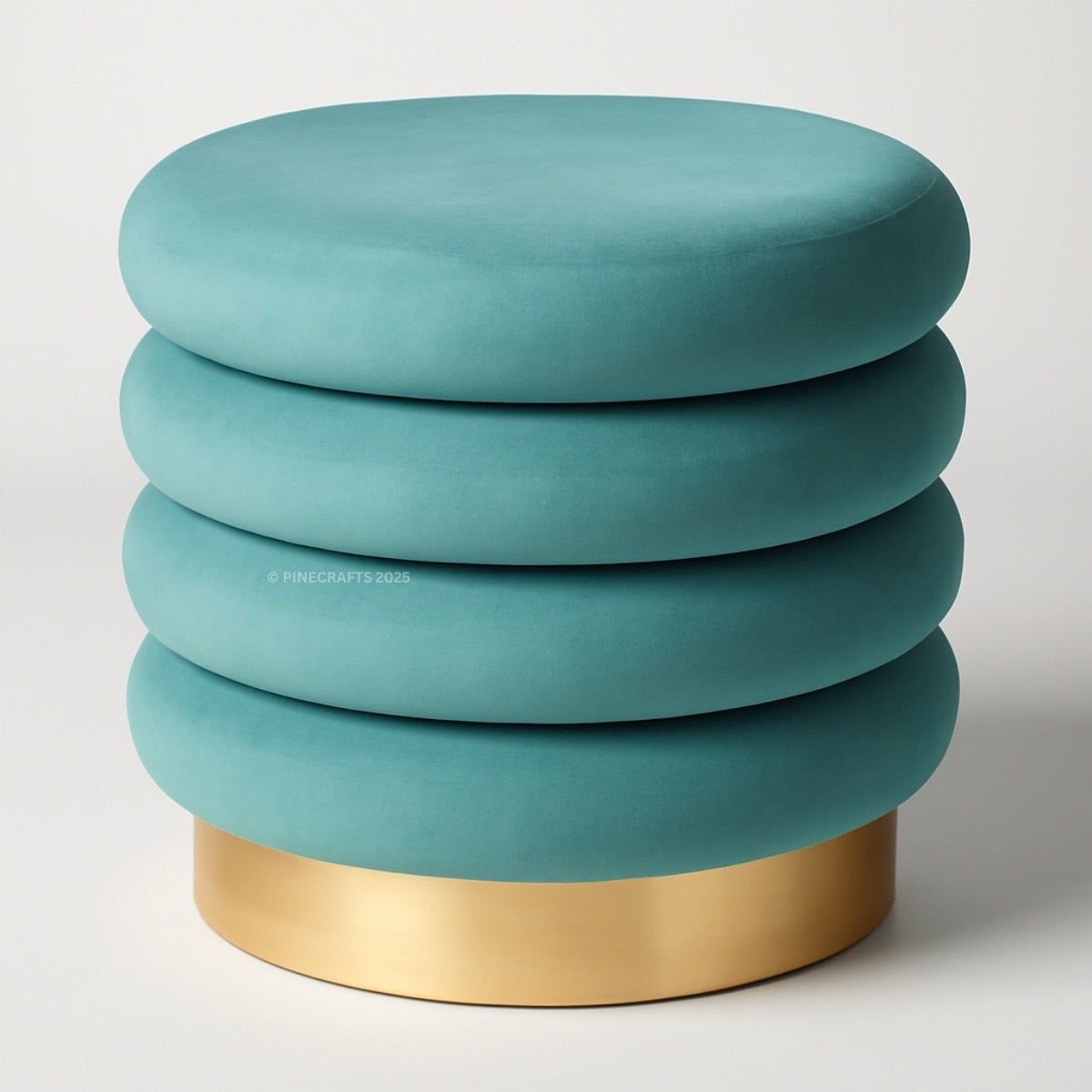 Teal ottoman with gold base on a white background