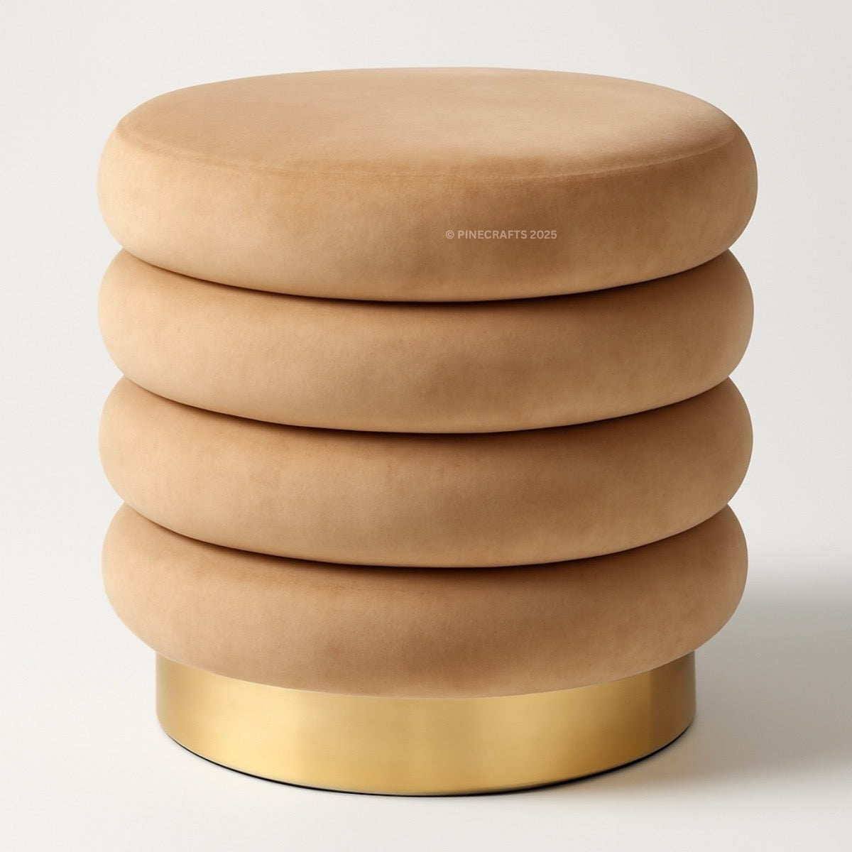 Beige ottoman with stacked cylindrical designs and a gold base on a white background