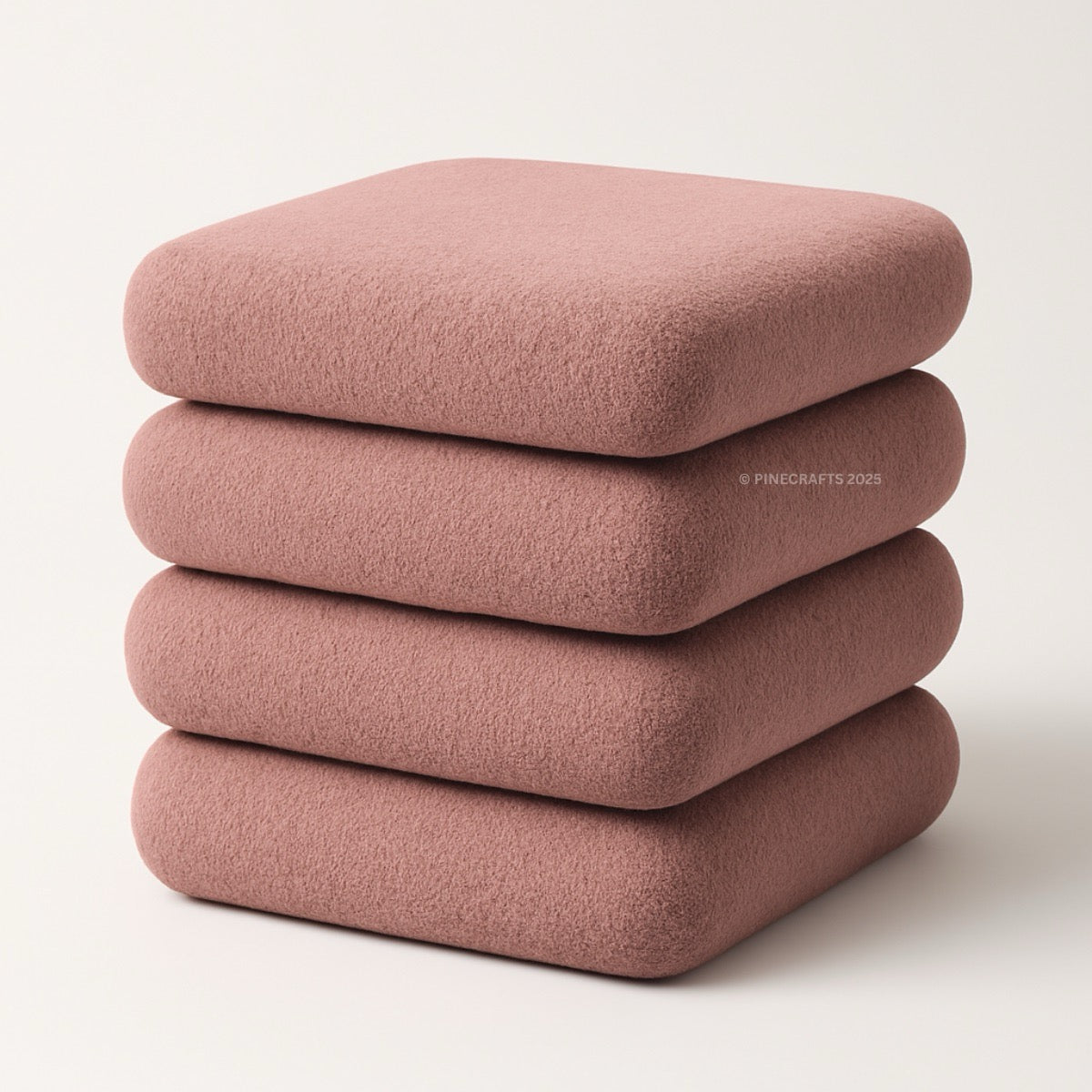 Stack of four pink cushions on a white background