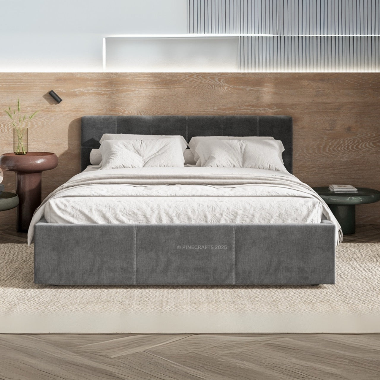 Gray upholstered bed with white bedding in a modern bedroom setting.