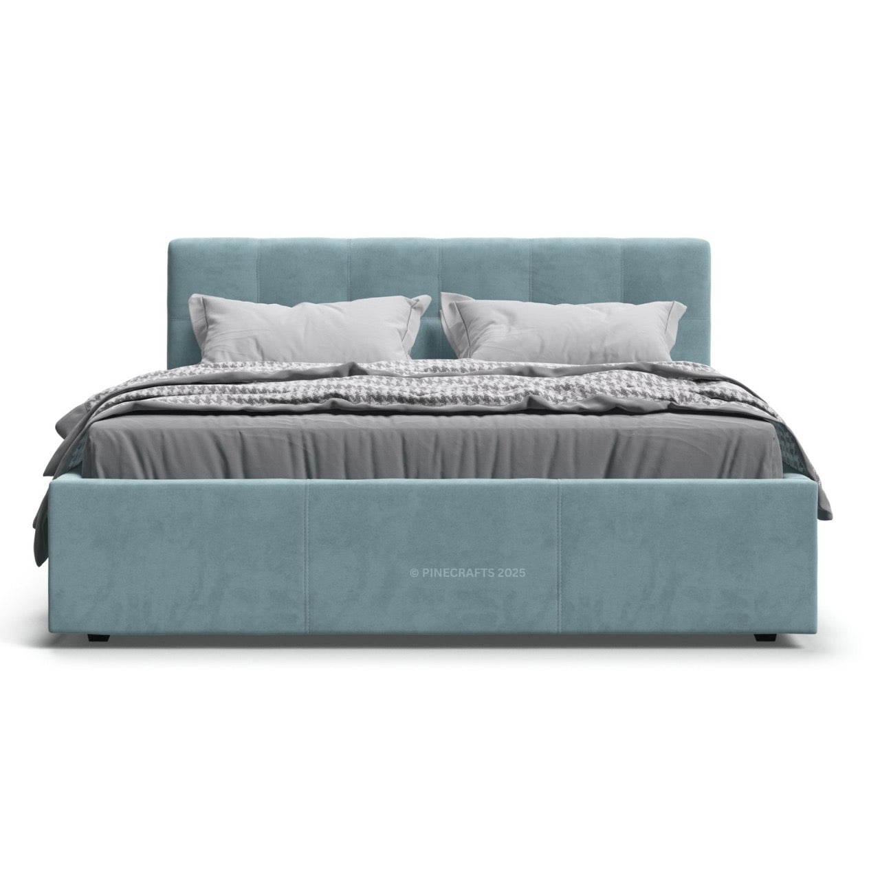 Blue upholstered bed with gray bedding on a white background