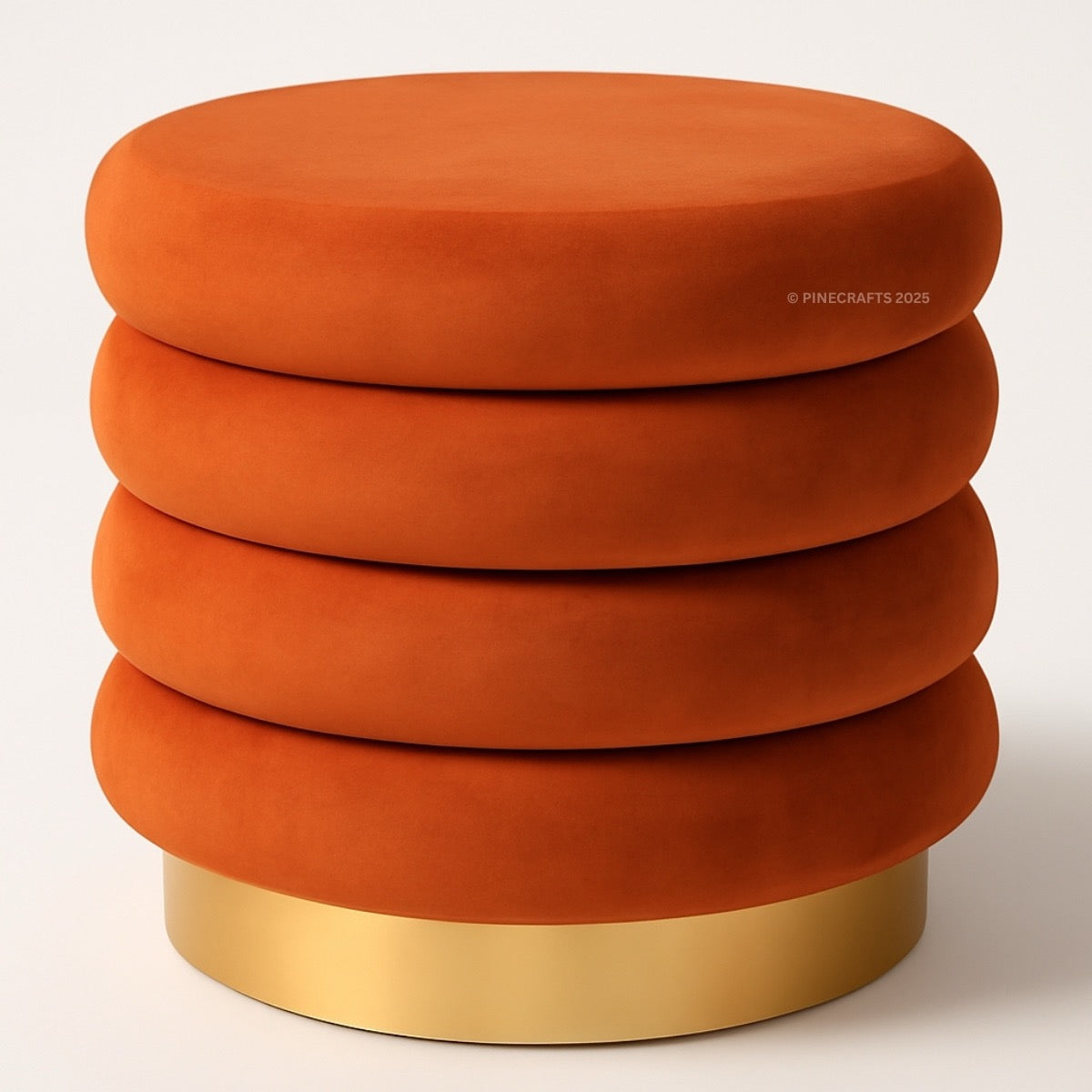 Stack of orange cylindrical stools with a gold base on a white background