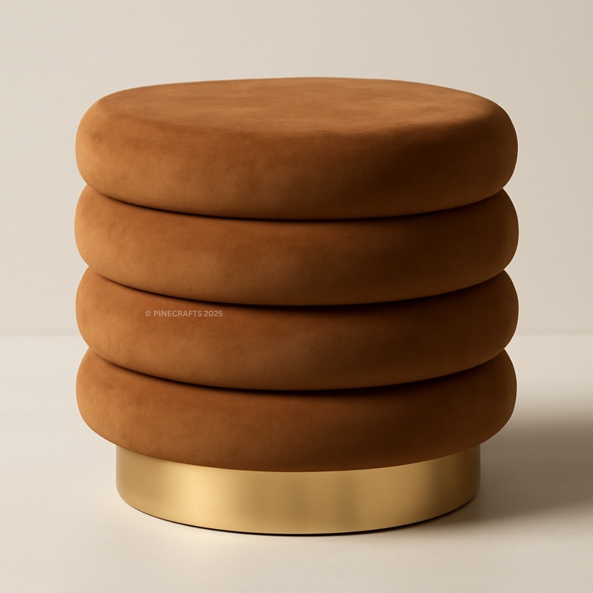Brown ottoman with a gold base on a beige background