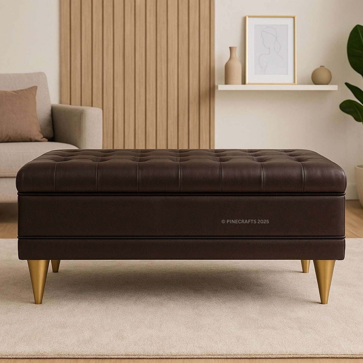 Brown leather ottoman with gold legs in a living room setting